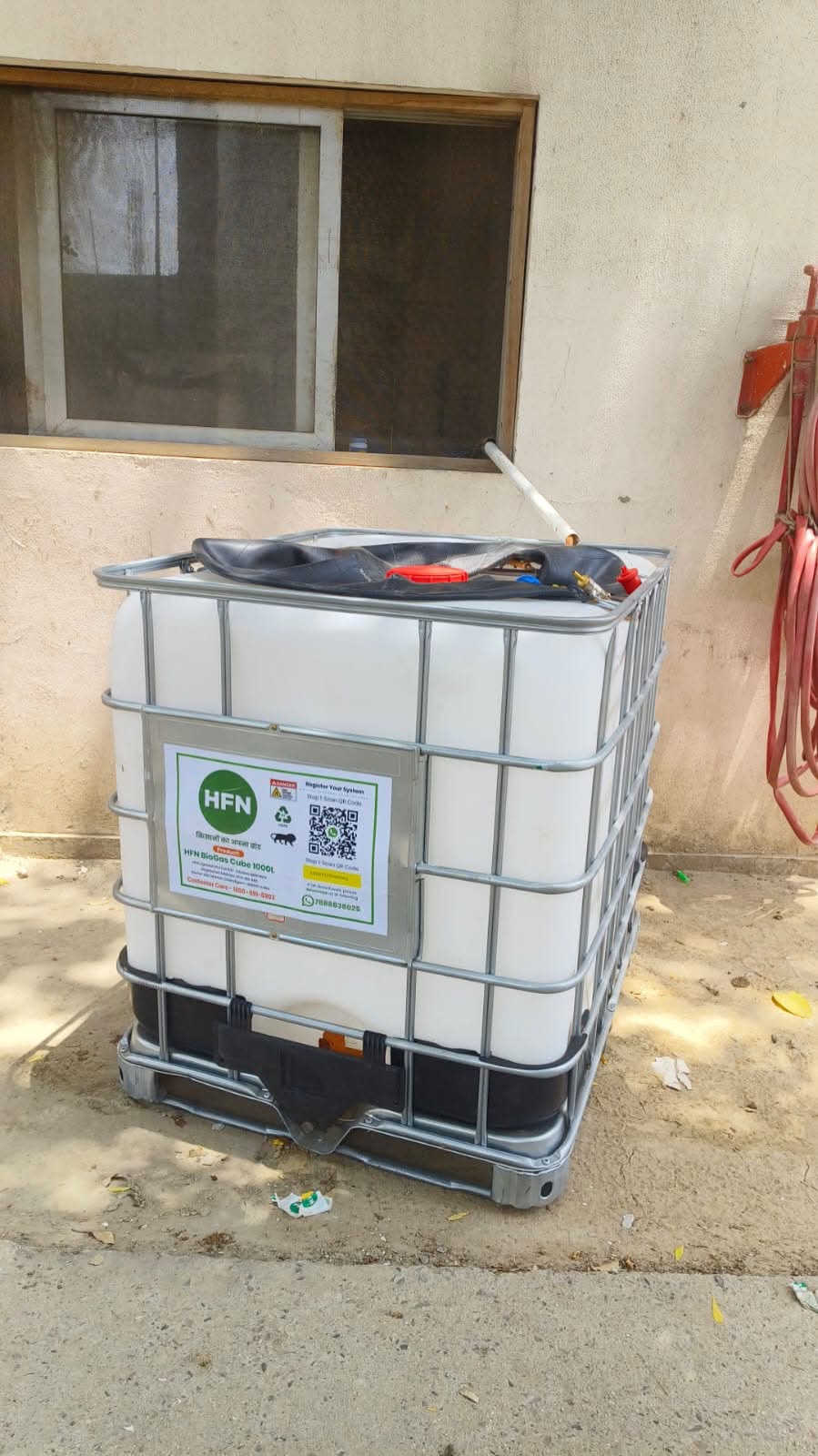 HFN BioGas Cube placed beside a home wall
